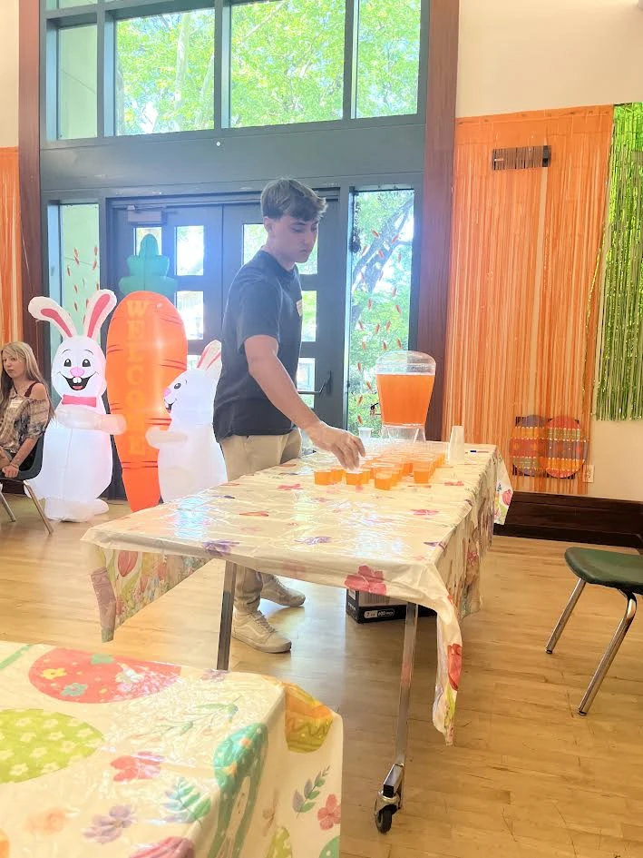 Sammy preparing refreshments at a spring community event